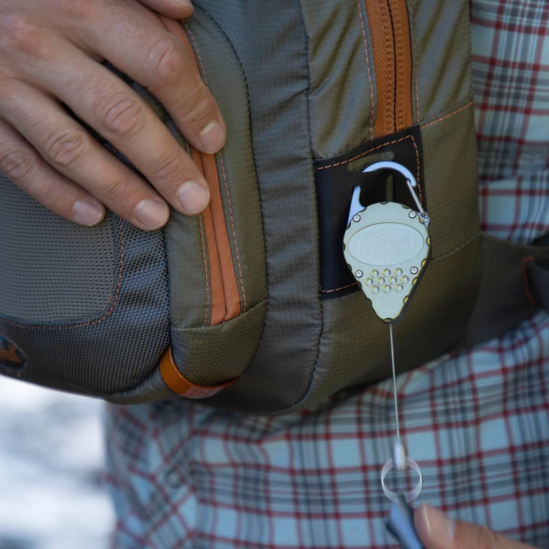 Fishpond Arrowhead Retractor Moss Attached to Bag